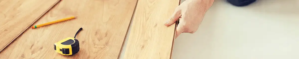 A professional installing wood flooring in Richmond, VA