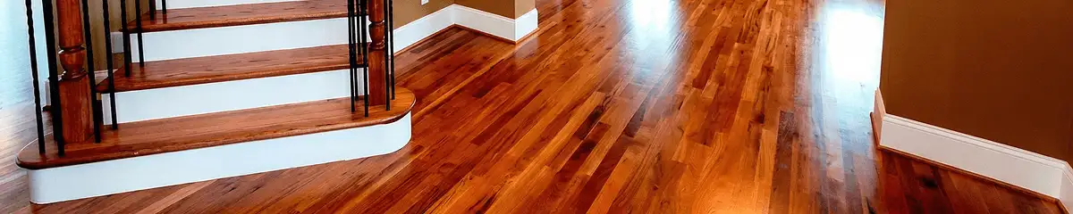 Base floor of a staircase with professionally restored wood flooring in Richmond VA