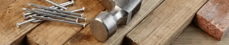 Hammer and nails on hardwood flooring boards in Richmond, VA