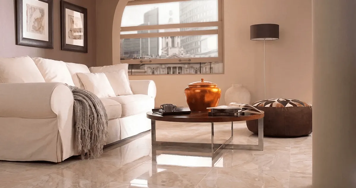 Modern living room with professionally installed marble flooring, a beige sofa, coffee table in Richmond, VA
