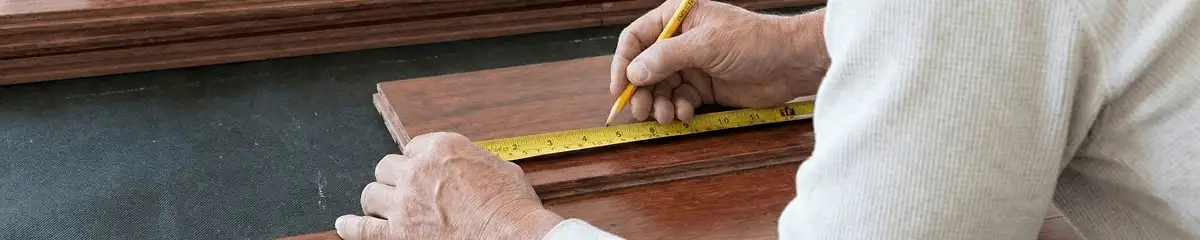 A professional installing wood flooring in Richmond, VA